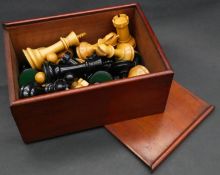 An wooden boxed weighted complete boxwood and ebony chess set. H.8cm (queen)