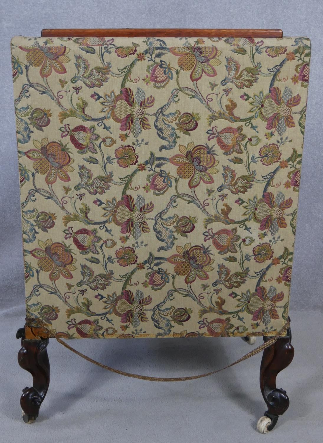 A mid Victorian carved mahogany nursing chair in floral upholstery on cabriole supports. H.110cm - Image 3 of 5
