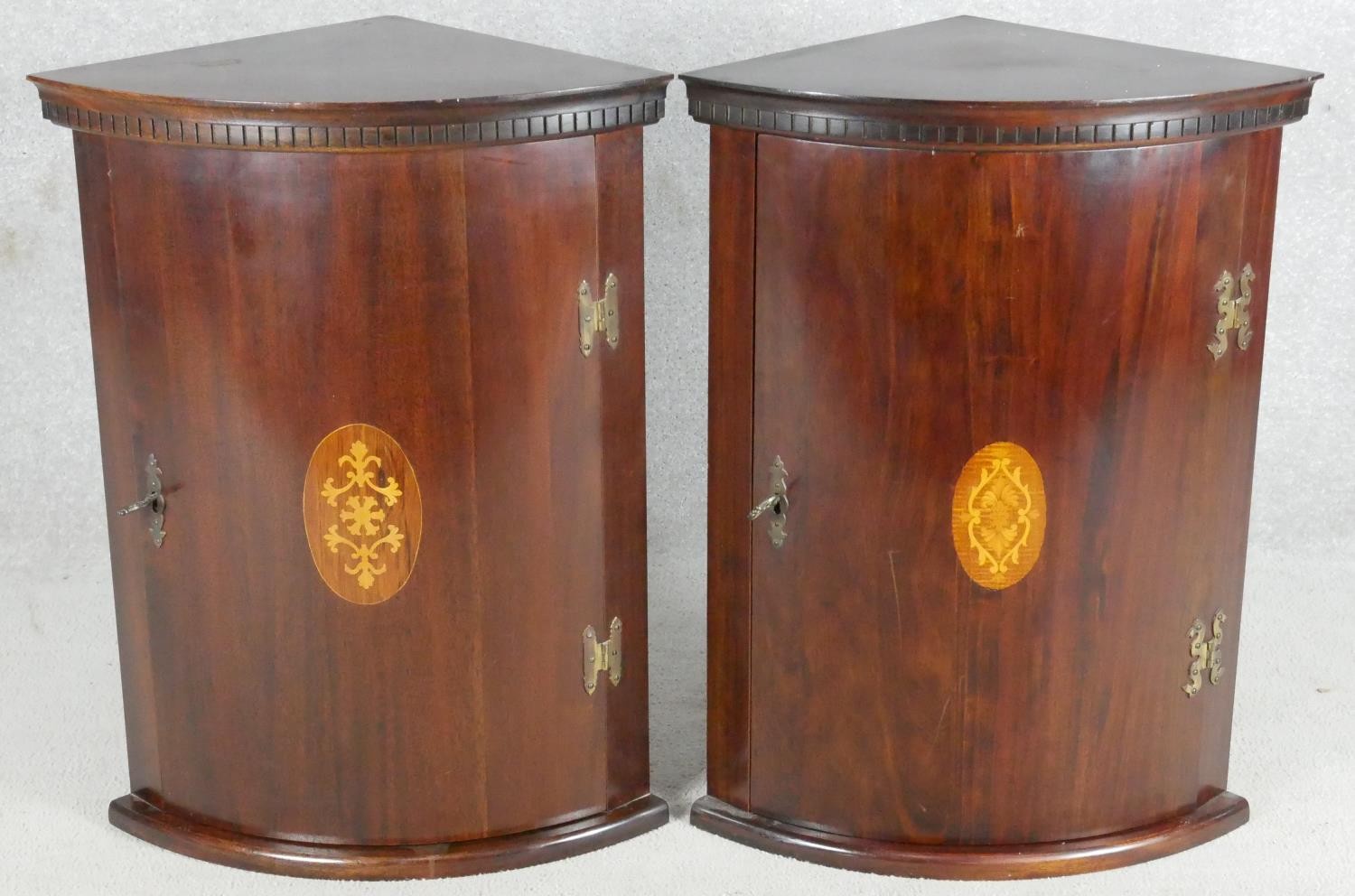 A pair of mahogany Georgian style bow fronted corner cabinets with central satinwood inlay. H.67cm - Image 2 of 6