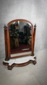 A large Victorian mahogany swing toilet mirror on shaped marble base. H.105cm (marble damaged as
