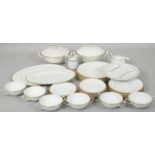 A Suzie Cooper gilded white gadrooned fine bone china six person part dinner service. Including