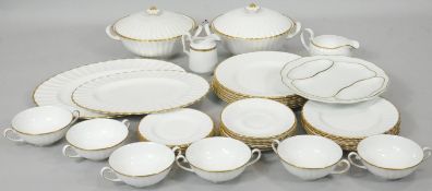 A Suzie Cooper gilded white gadrooned fine bone china six person part dinner service. Including