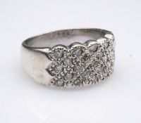 A 9 carat white gold diamond set ring, set with twenty three round brilliant cut diamonds, with a