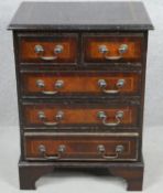 A small Georgian style mahogany crossbanded chest of drawers on bracket feet. H.62 W.46 D.33cm