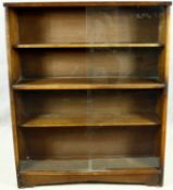 A vintage teak bookcase with sliding glass plate doors. H.113 W.91 D.24cm