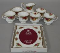 Six Royal Albert 'Old Country Roses' tea cups and a boxed matching photo frame. L.24.5 W.19.5cm (