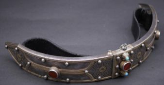 A Caucasian Niello work white metal ceremonial belt, with scrolling foliate and floral design, set