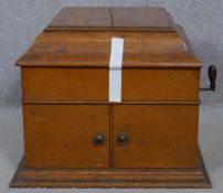 A C.1900 oak cased wind up gramophone. H.35 L.50 W.43.5cm