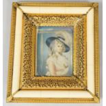 A 19th century faux ivory and gilt metal framed miniature on panel, depicting a young lady in formal