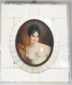 A 19th century ivory mosaic and mother of pearl framed miniature on ivory, depicting a young lady in