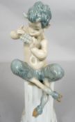 A Lladro Porcelain Satyr/Faun figure. Signed with impressed Lladro Mark, Made In Spain. H.27