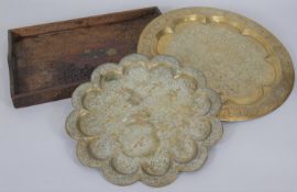 A shaped and engraved Benares tray along with a similar example and a carved Eastern hardwood