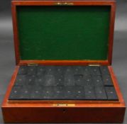 An antique mahogany boxed 90 piece bone, ebony and brass domino set. Each piece with painted