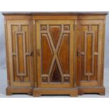 An early 20th century mahogany dwarf breakfront credenza with gadrooned edges and beading all around