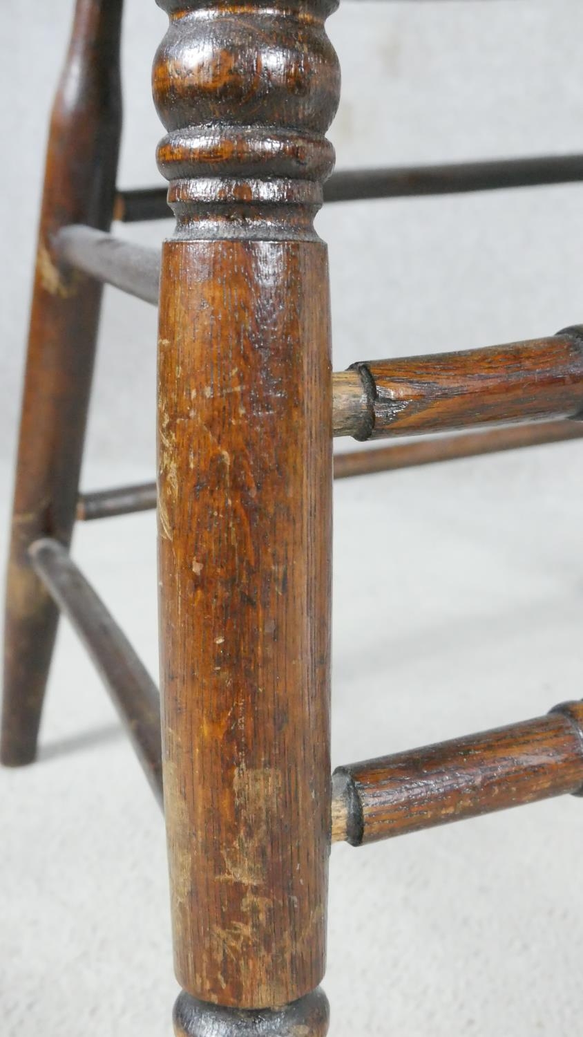 A late 19th century oak captain's desk chair with spindle back on stretchered supports. H.76cm - Image 4 of 5