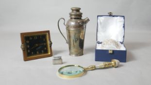 A miscellaneous collection to include a hallmarked silver Colibri lighter, a cased Art Glass vase, a