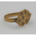 A Roman style evil eye bronze ring, an ellipse shape plaque with ring marking on a court shape band.