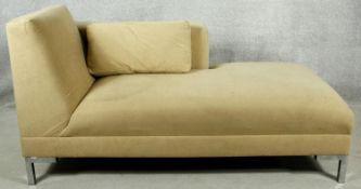 A contemporary chaise longue in faux suede upholstery on chrome supports. H.80 W.155 D.70cm