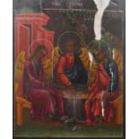 A 19th century Russian icon painted on wood, depicting the holy trinity with cyrillic writing. (