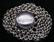 A long antique silver chain and gun metal sovereign holder. The heavy round rolo link chain