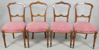 A set of four 19th century walnut chairs with satinwood Arabesque and line inlay on tapering