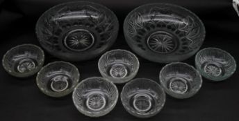 A collection of nine frosted cut glass bowls with engraved stylised foliate design and star cut