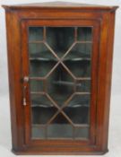 A 19th century oak hanging corner cabinet with astragal glazed doors. H.108 W.75 D.42cm