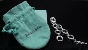 A Ralph Lauren silver tone stirrup chain link bracelet with Tiffany pouch and box. Stamped RLL. L.7"