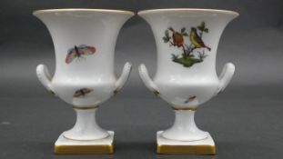 A pair of miniature porcelain Herend urns with hand gilded and painted bird and insects design. H.