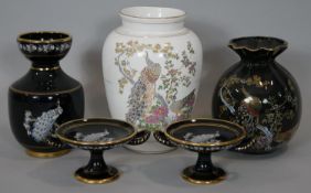 A collection of Greek ceramic pieces with 24 carat gold detailing, decorated with peacocks. Makers
