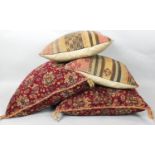 A large pair of tapestry covered cushions and two kelim examples. L.54cm