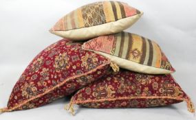 A large pair of tapestry covered cushions and two kelim examples. L.54cm