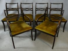 A set of six Regency style mahogany dining chairs with ropetwist backs above drop in seats on