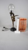 An Art deco style lamp in the shape of a dancer and a rock salt lamp in the form of a corbel. H.54