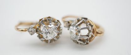 A pair of Belle Époque dormeuse old mine diamond and yellow gold earrings. Each set with a cushion