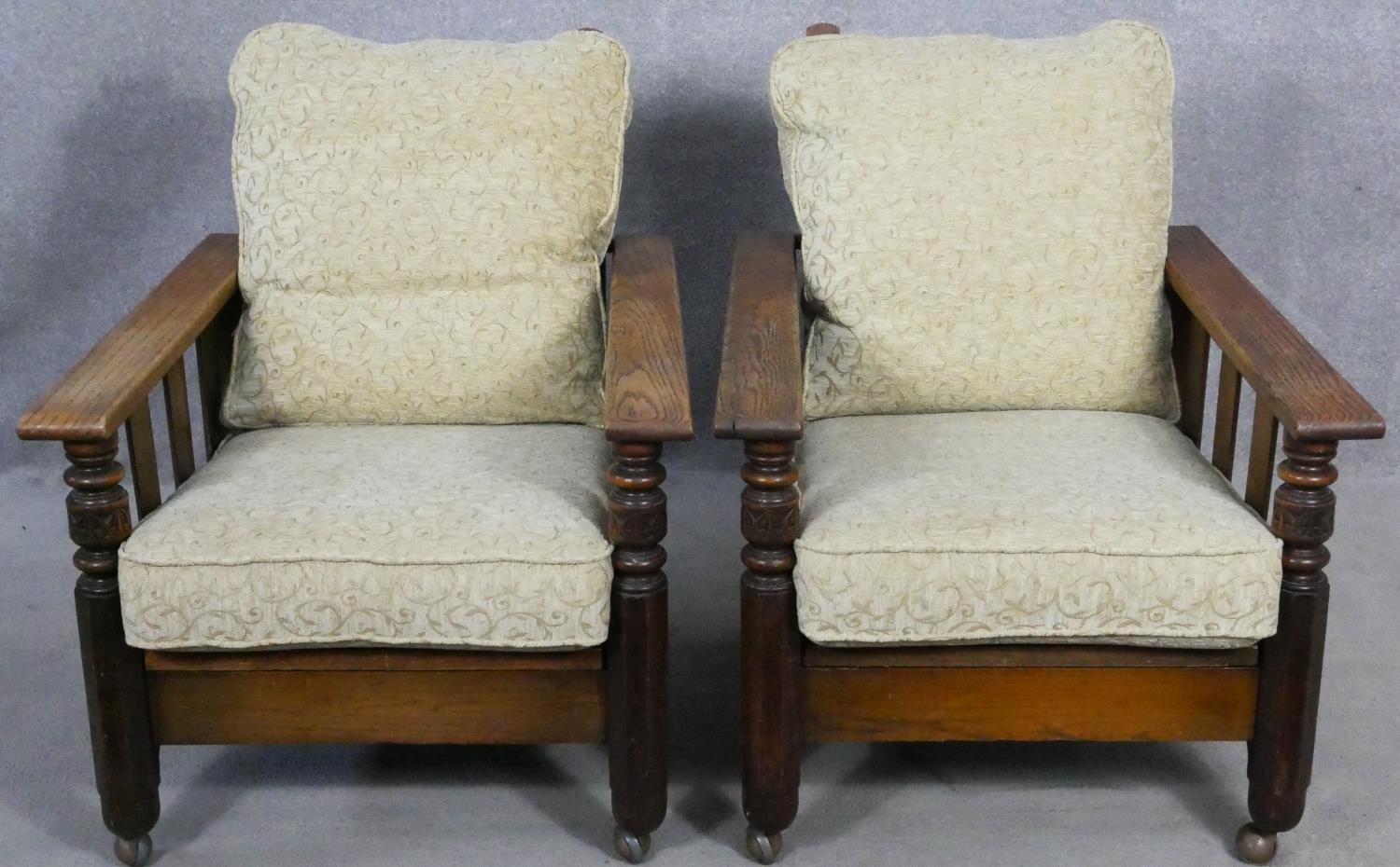 A pair of mid century oak framed armchairs with sliding reclining action newly upholstered in cut