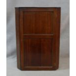 A 19th century oak wall hanging corner cupboard. H.104 W.73.5 D.40cm