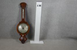 A Victorian rosewood banjo barometer with silvered dial. L.104cm (mercury tube damaged as