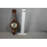 A Victorian rosewood banjo barometer with silvered dial. L.104cm (mercury tube damaged as