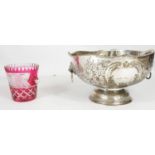 A large silver plate repousse punch bowl and ladle and a cranberry glass cut to clear ice bucket