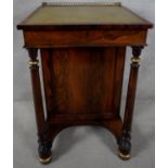 A Regency rosewood Davenport with pierced brass top rail above leather lined writing slope revealing