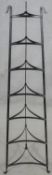 A wrought iron graduating pan stand.H.132cm