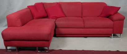 A ROM corner sofa with adjustable back cushions, converting to a double bed, on chrome supports. H.