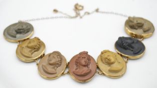 An antique yellow metal mounted articulated lava cameo necklace converted from bracelet. The