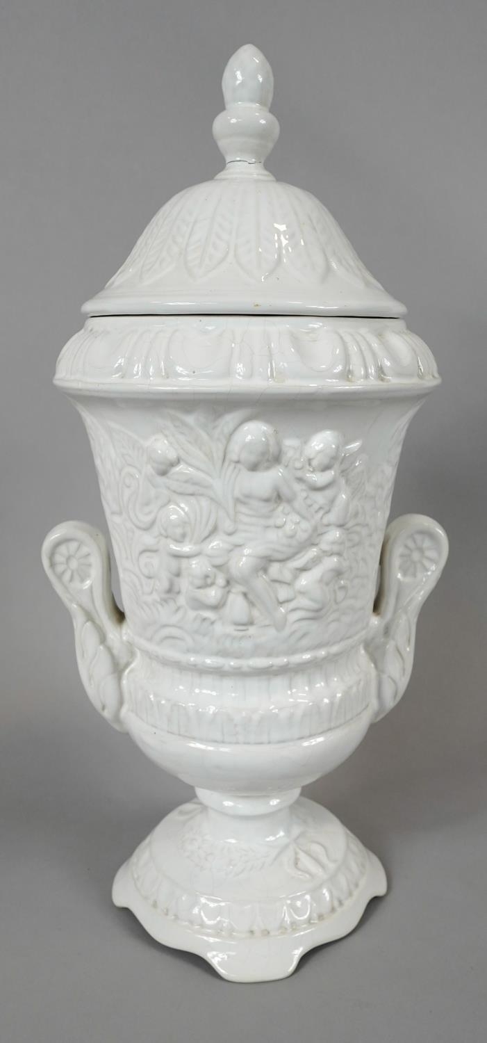 A Pereiras ceramic Portuguese white glazed Classical design two handled lidded urn. Makers stamp - Image 2 of 6