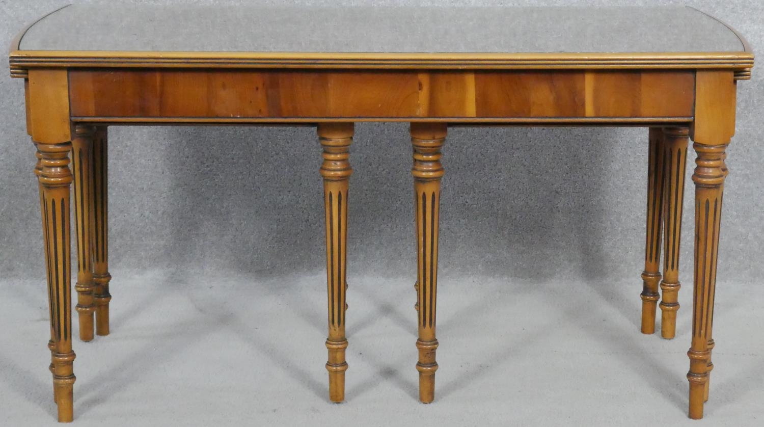 A nest of Regency style yew wood occasional tables with plate glass and inset tooled leather tops on - Image 2 of 6