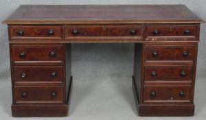 A mid 19th century mahogany three section pedestal desk with inset faux leather top above