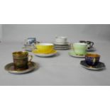 A collection of seven teacups and saucers and other saucers. Including a Fitz and Floyd orchid