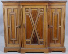An early 20th century mahogany dwarf breakfront credenza with gadrooned edges and beading all around