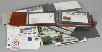 A large collection of first day stamp covers and antique postcards. Including two albums of first